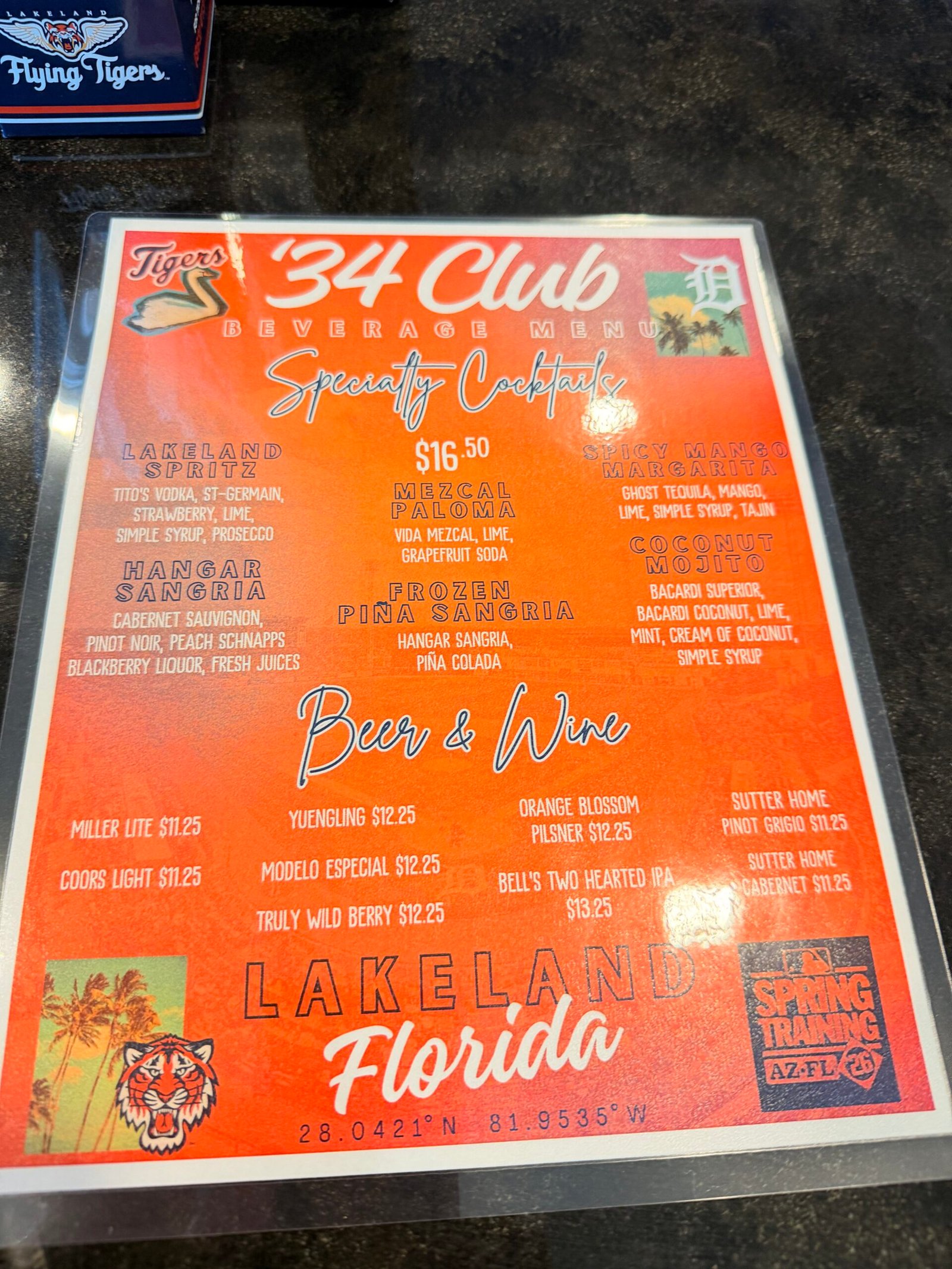 Tigers 34 Club orange beverage menu showing specialty cocktails and beer and wine options