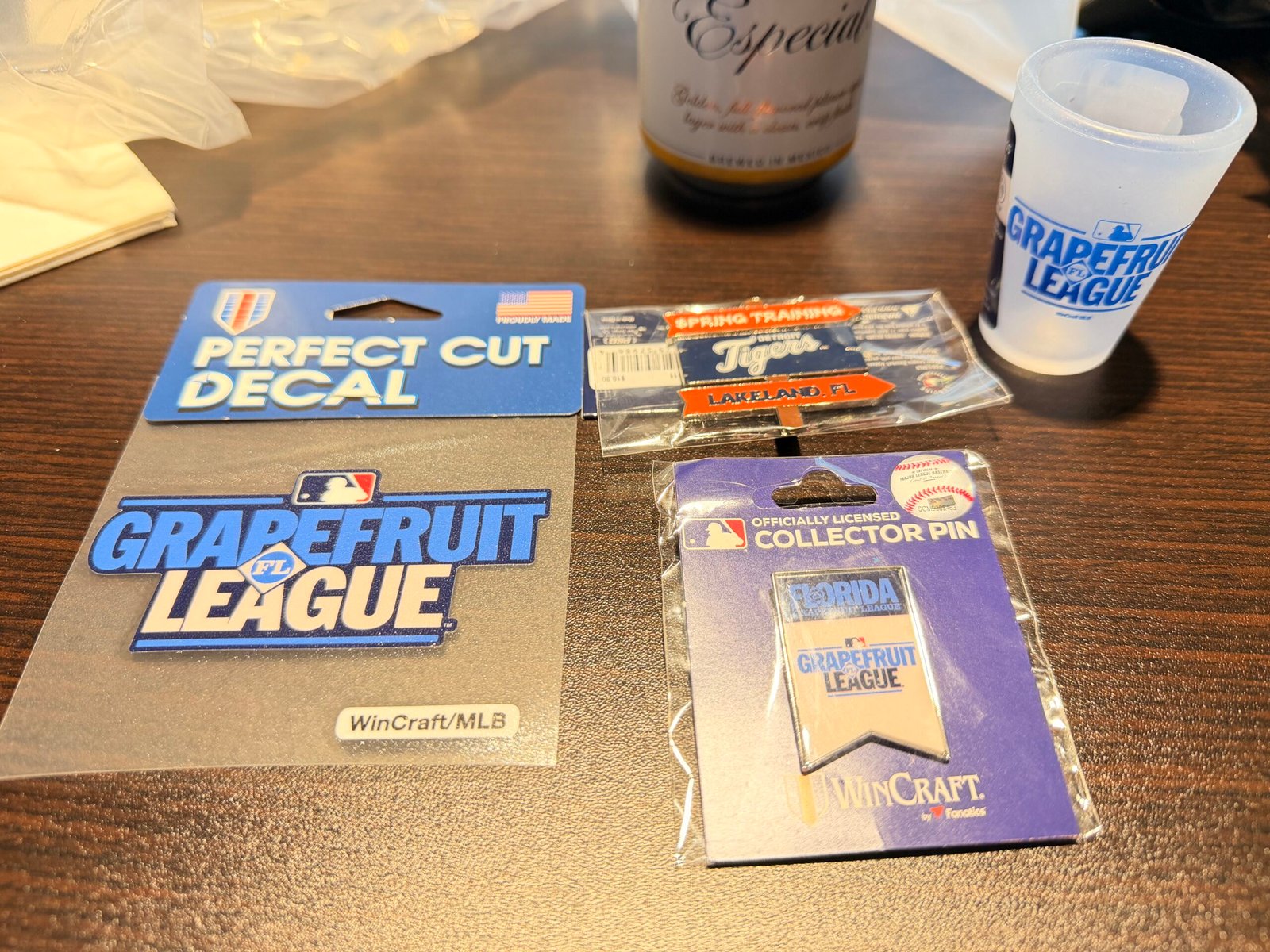 Team store merchandise including Grapefruit League decal, Tigers Lakeland FL Spring Training pin, Grapefruit League collector pin and souvenir cup