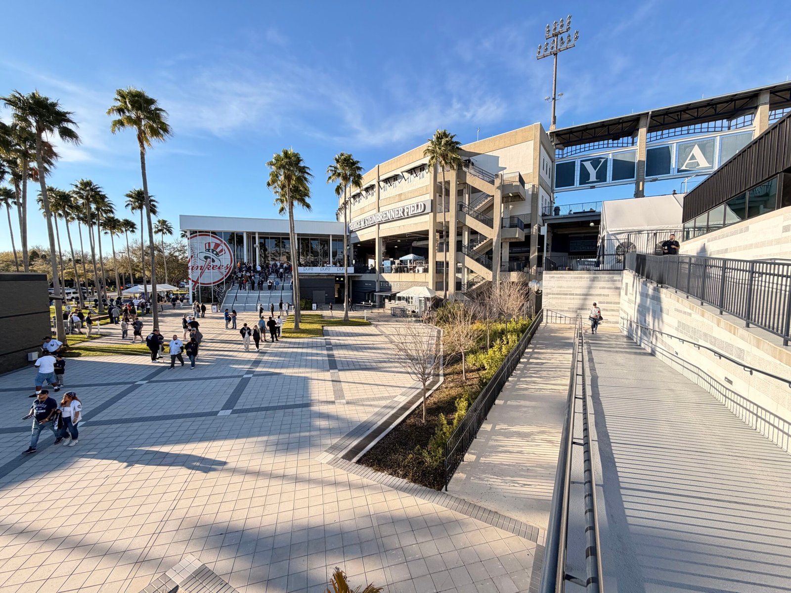 Steinbrenner Field main entrance with palm trees and the Yankees logo